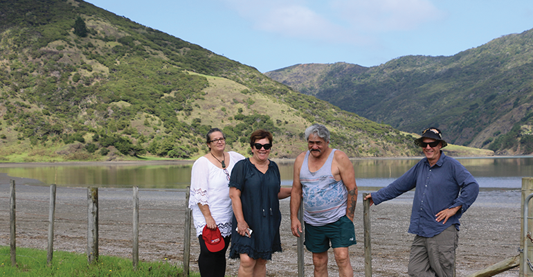 People at a lake in Te Hiku o Te Ika