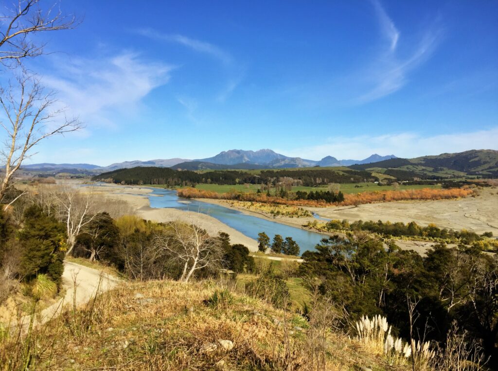 Hikurangi Maunga in background, river and fields in foreground