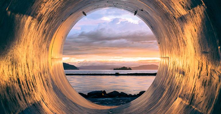 View from inside a sewer out onto the beach