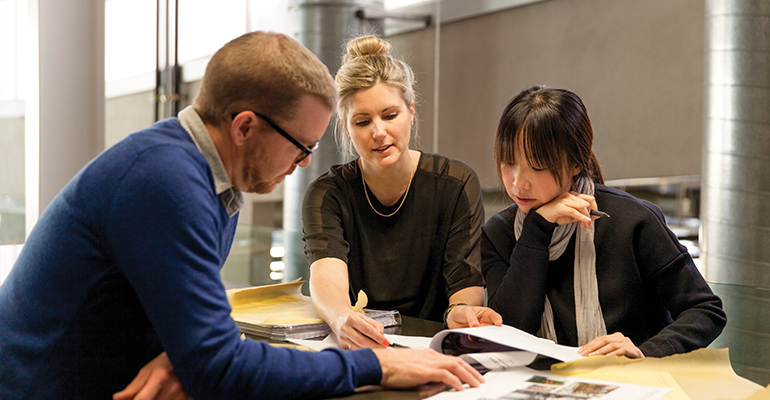 Three people doing business