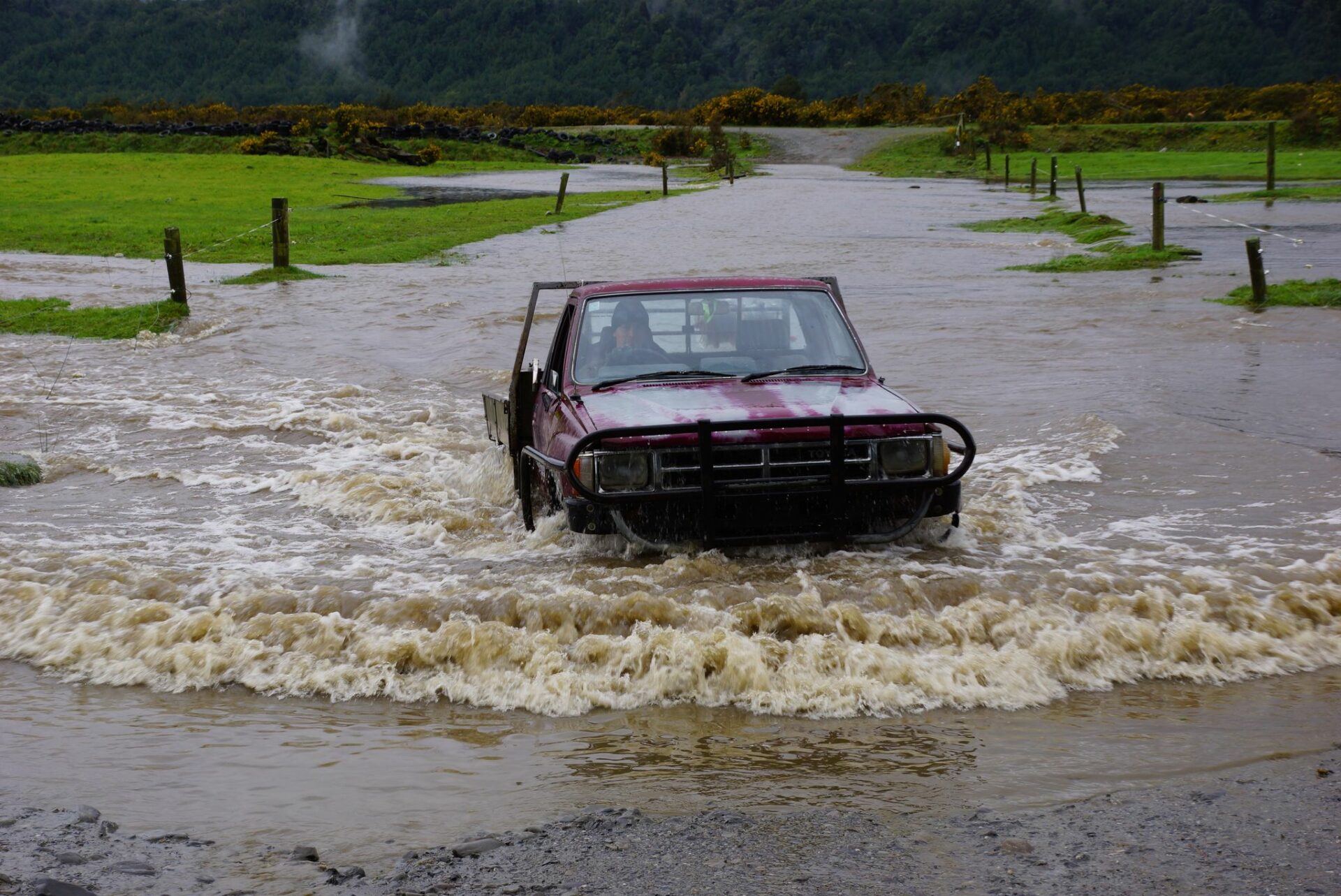 Ute driving through flood water